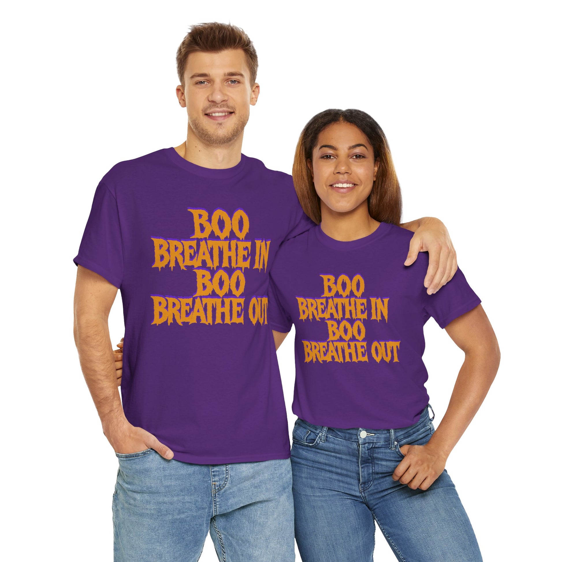 Two people wearing purple t-shirts with yellow text on a white background